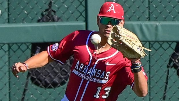 Arkansas left fielder Jayson Jones fields a ball against Murray State.